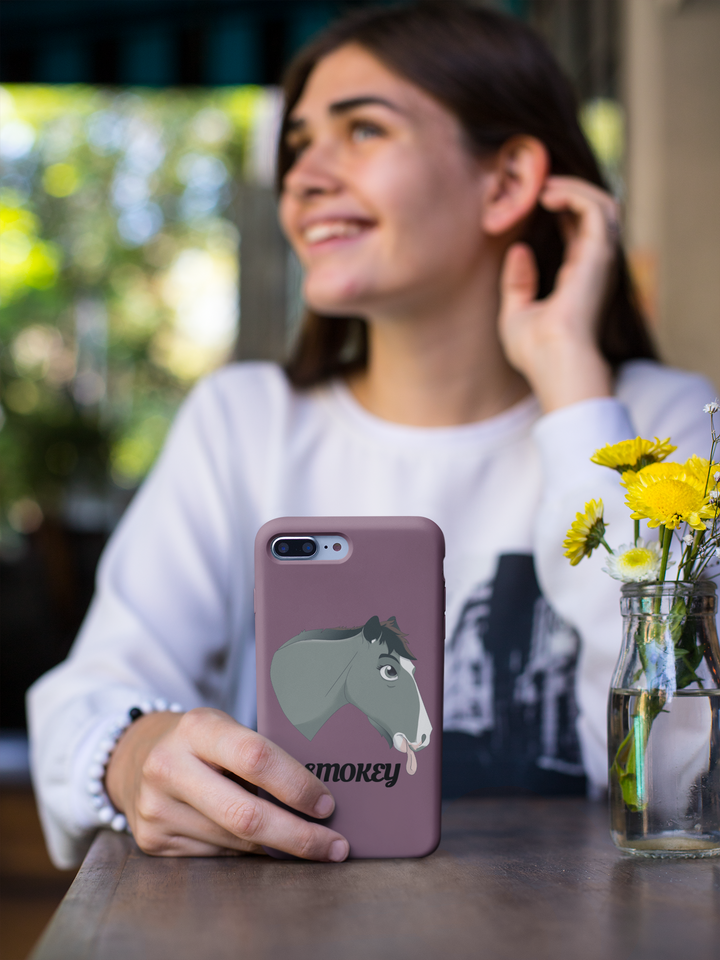 Woman holding a purple phone case with a Fairytale Cartoon horse portrait